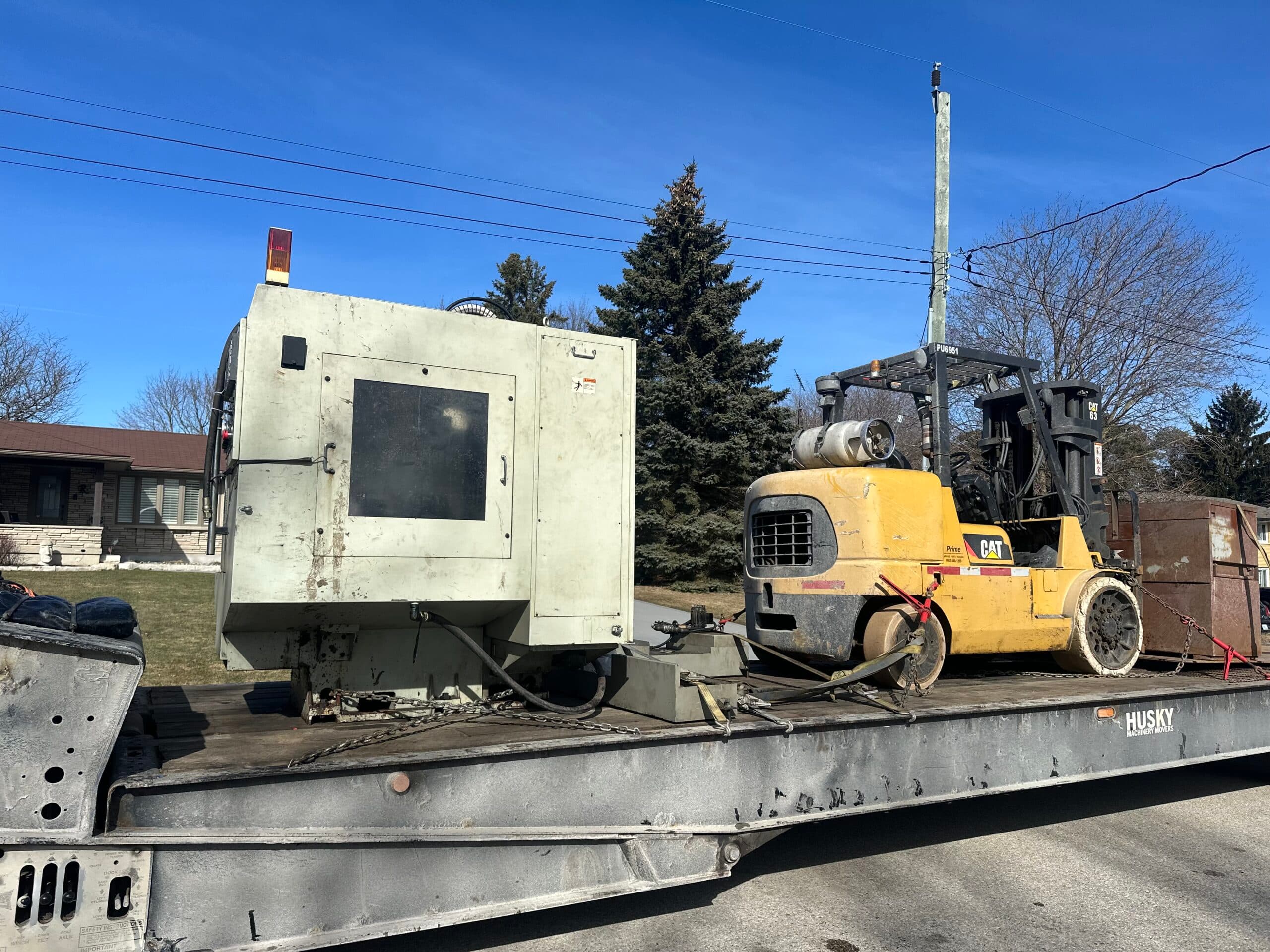 Complete plant relocation showing production line transfer and heavy machinery moving by certified riggers